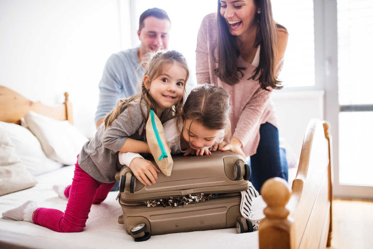 Family packing suitcase