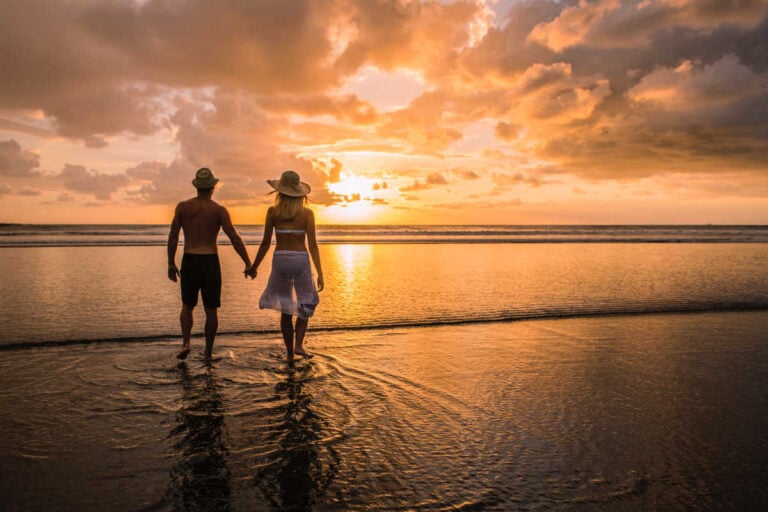 Couple on beach at sunset